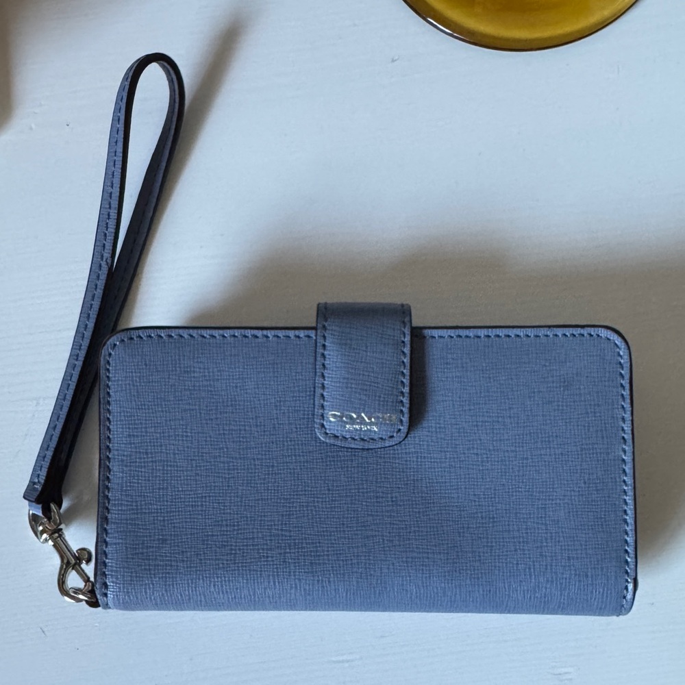 Blue Coach wallet with wrist strap